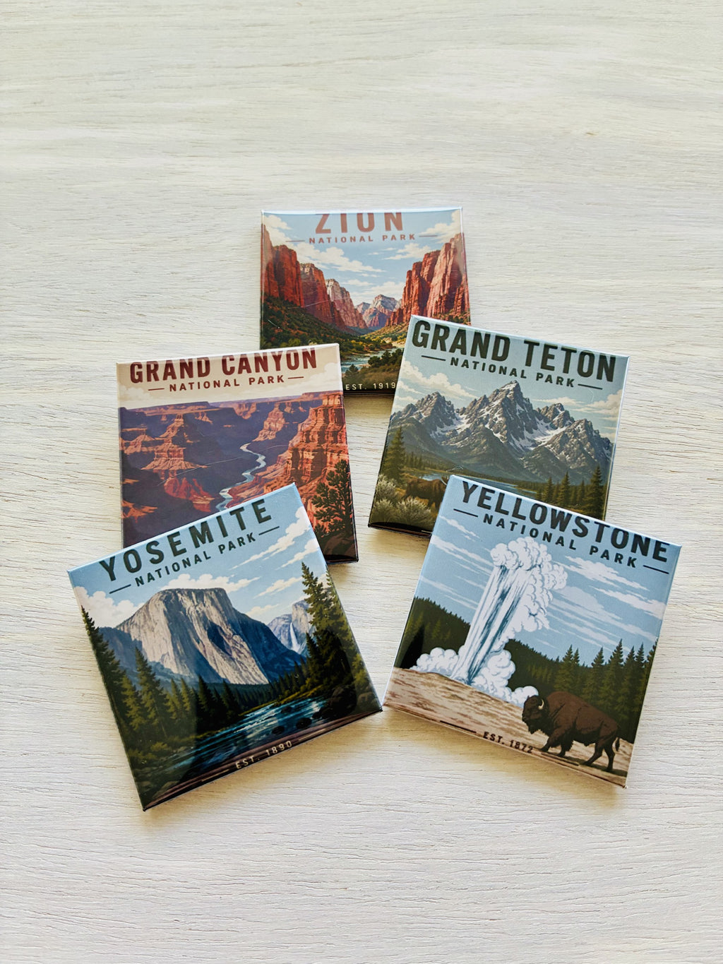Five National Park magnets on a textured surface
