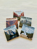 Five National Park magnets on a textured surface